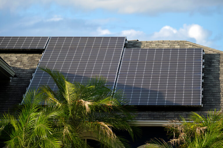 residential-house-with-rooftop-covered-with-solar-photovoltaic-panels-for-producing-of-clean-ecological-electrical-energy-in-suburban-rural-area